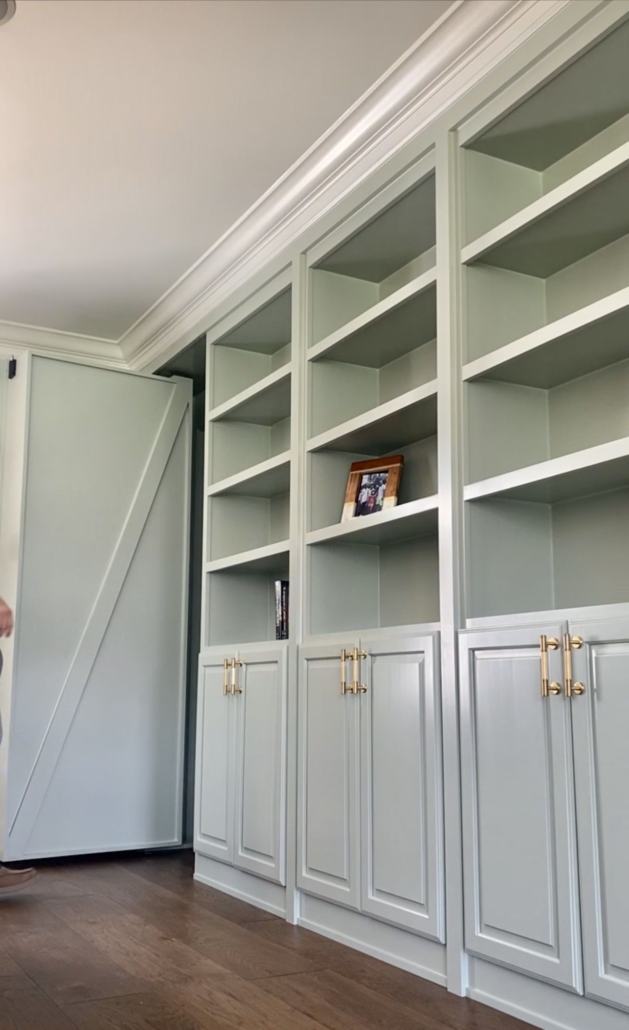 Built-in bookshelf with barn door