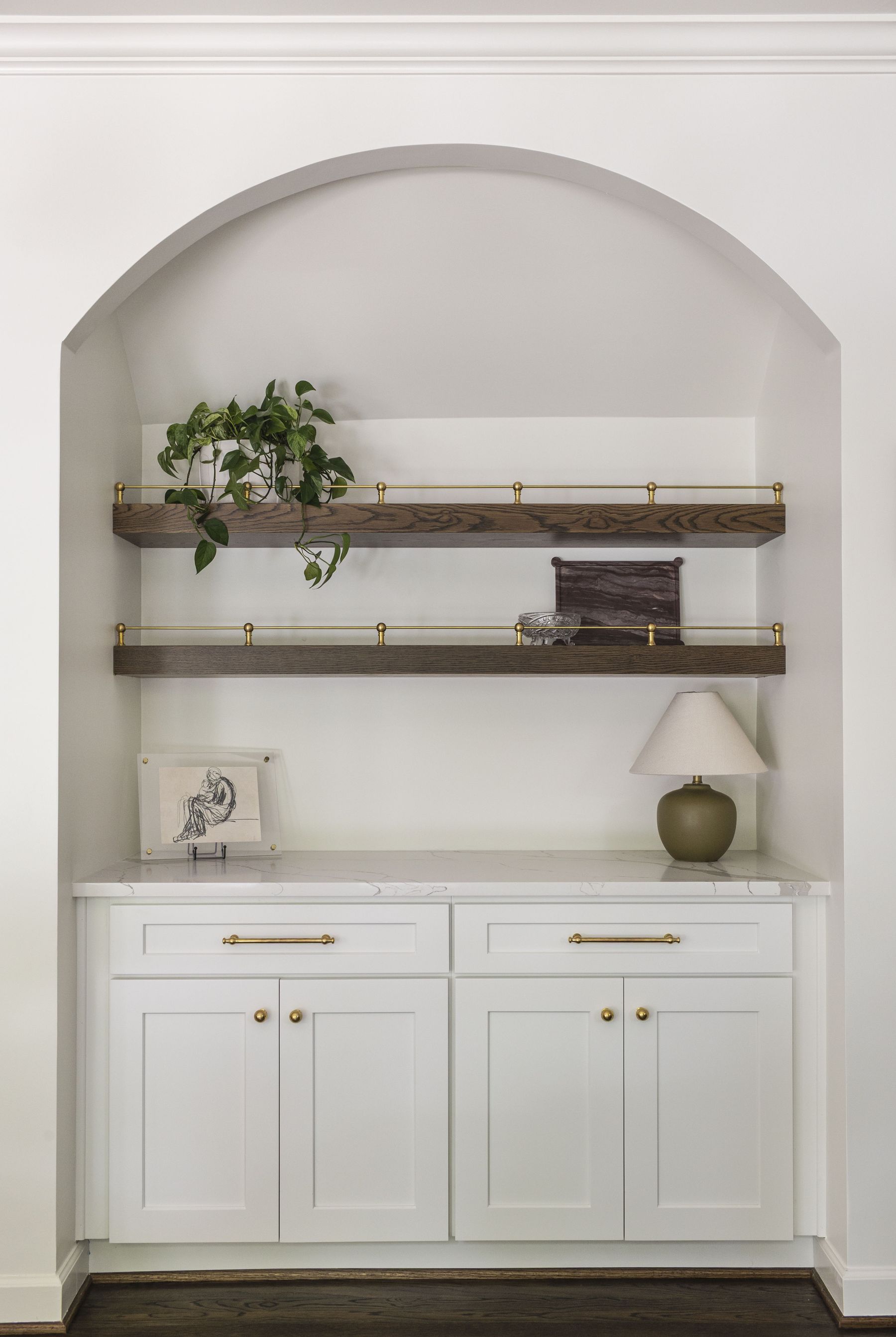 Built-in shelving nook with marble counter